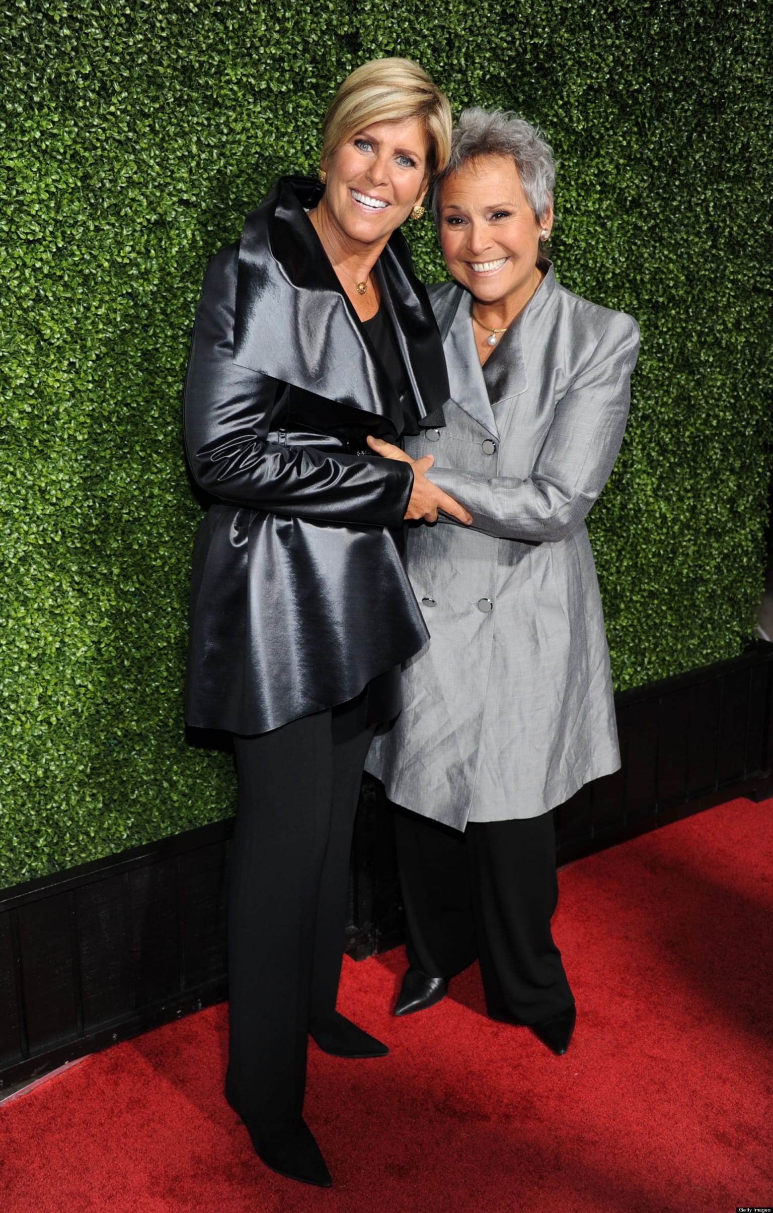 Suze Orman and Kathy Travis.